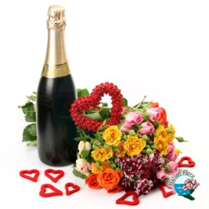Bouquet di rose fuxia con colomba pasquale e bottiglia di vino bianco