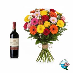 Bouquet misto colorato con bottiglia di vino rosso